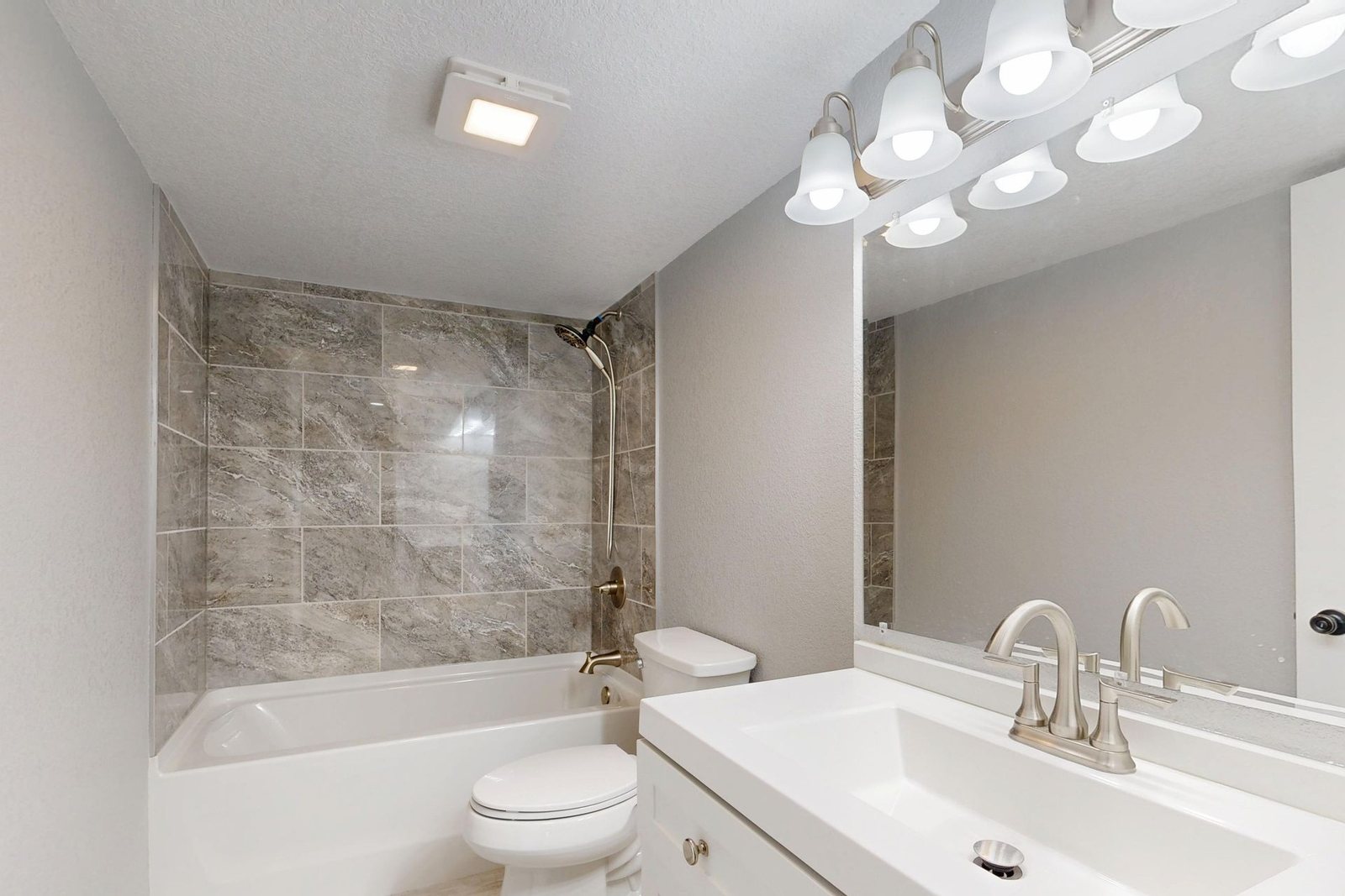 Bathroom with tub and vanity cleaned