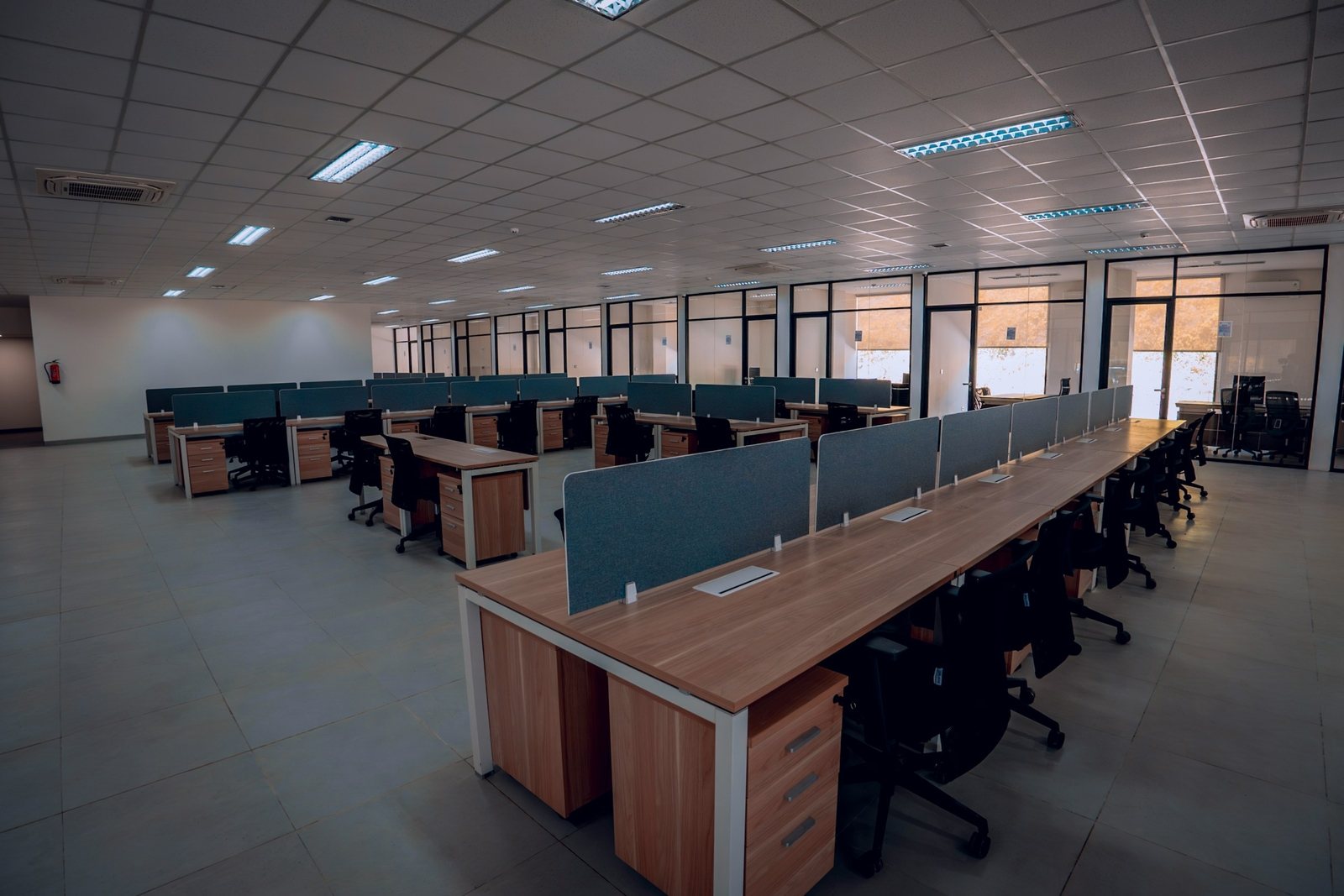 Rows of desks cleaned across an office floor