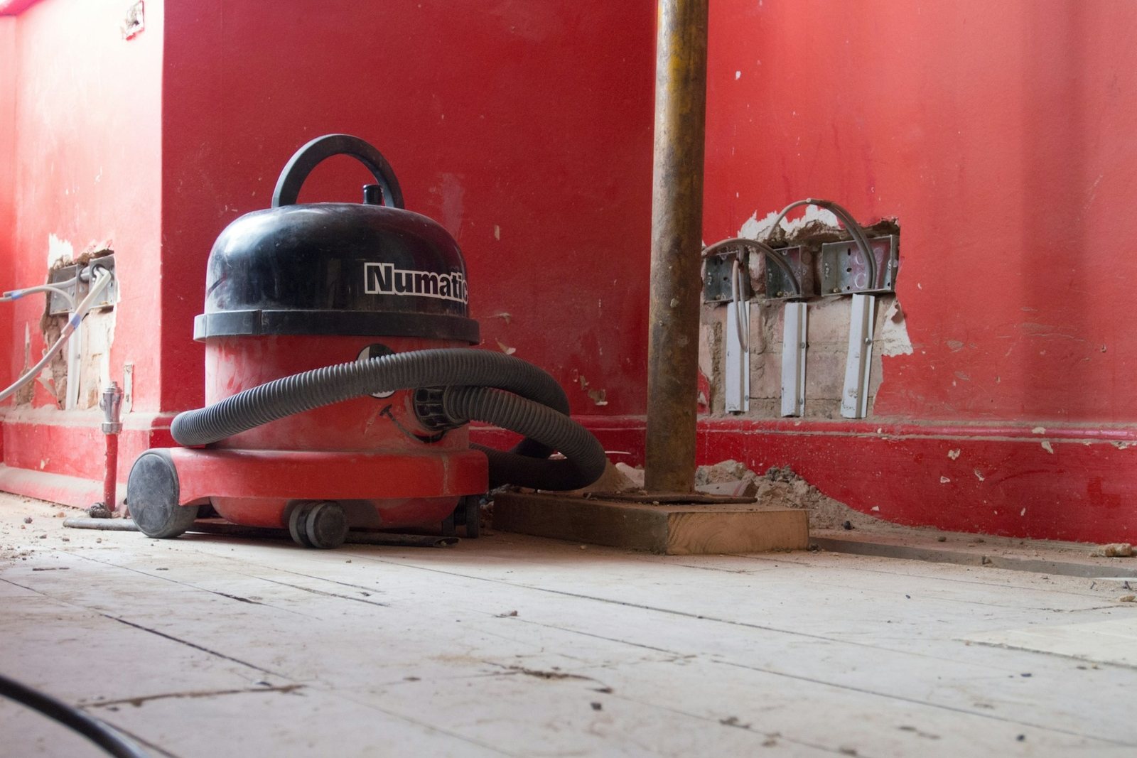 Site vacuum clearing drywall dust from a new floor
